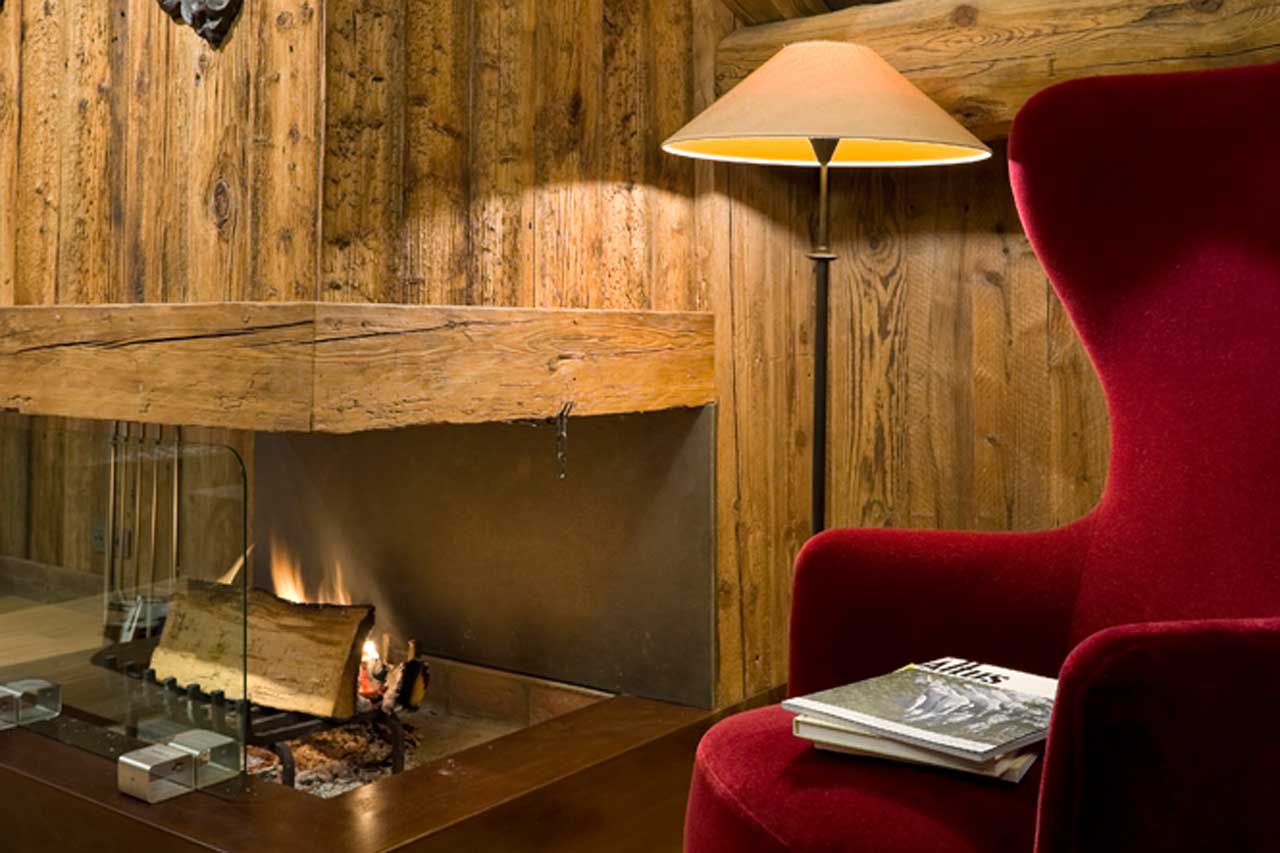 Top floor living room with open fireplace at Chalet Baloo in Chamonix