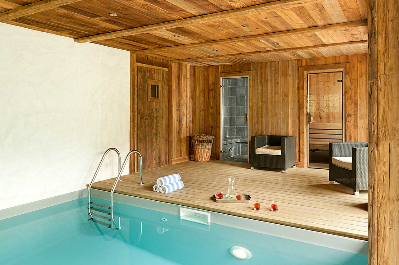 Spa area with plunge pool and relaxation deck at Chalet Baloo in Chamonix