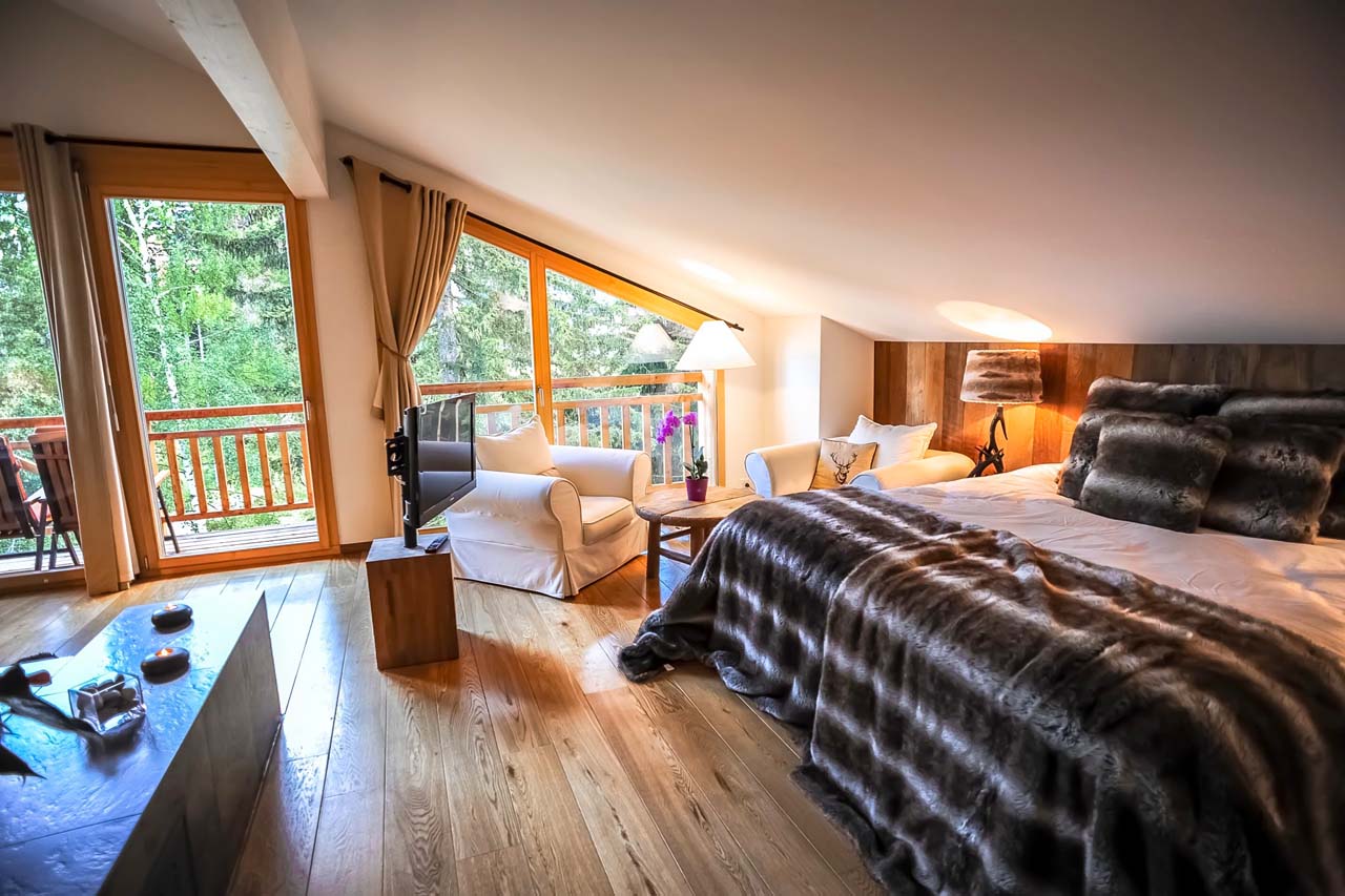 Chalet Le Torrent in Crans Montana double bedroom with TV