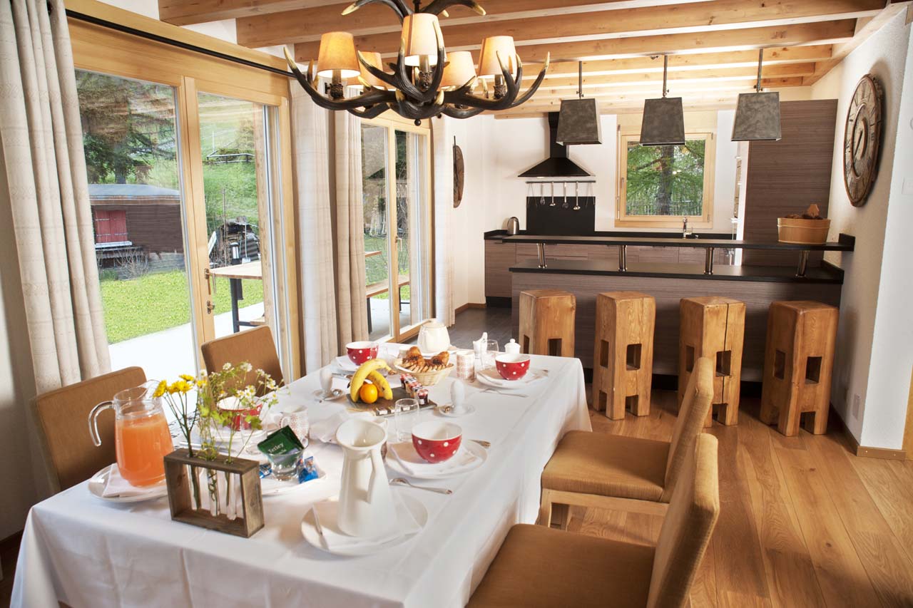 Chalet Le Torrent in Crans Montana dining table and breakfast bar