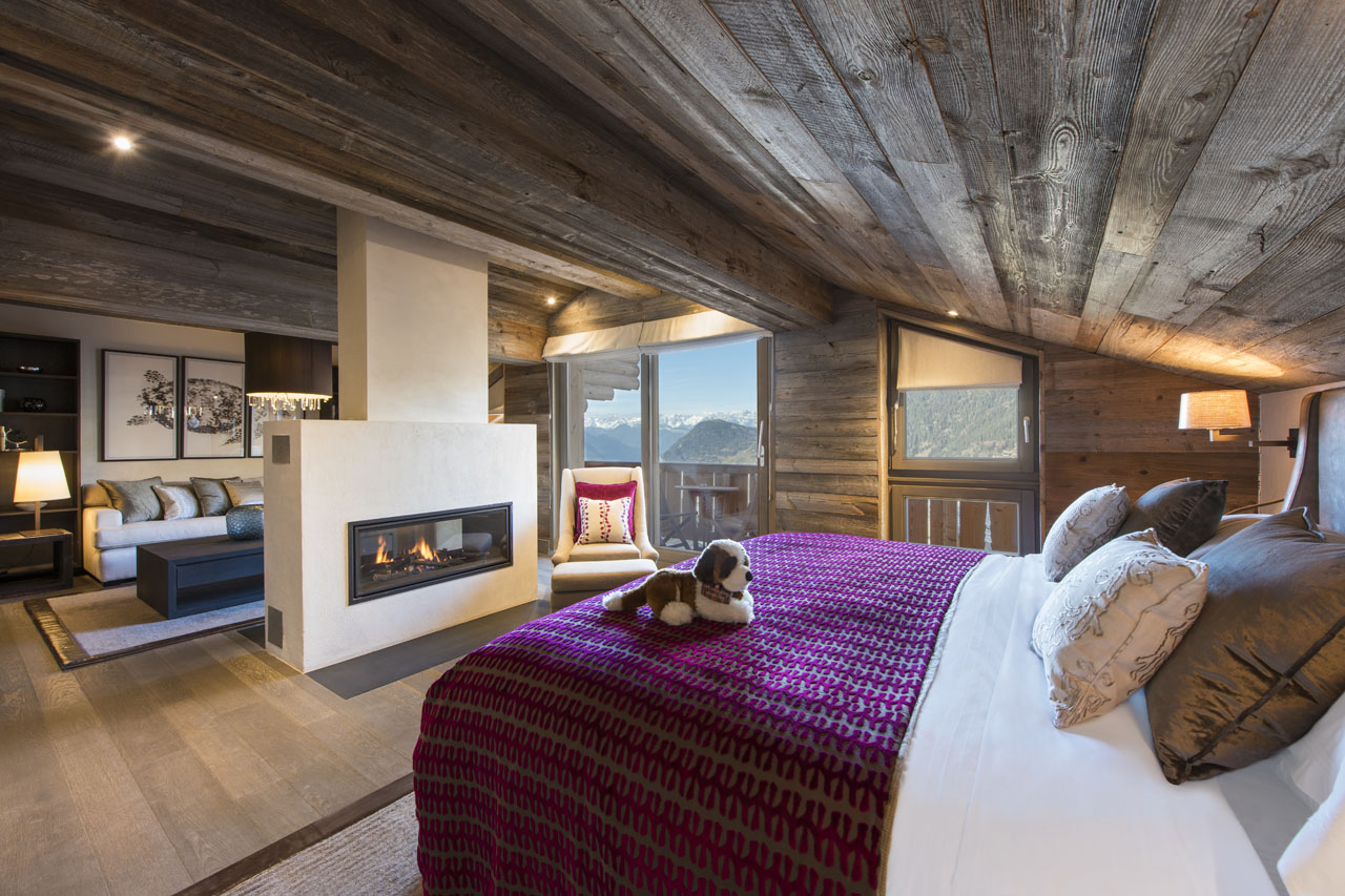 The Lodge Verbier master bedroom with fireplace