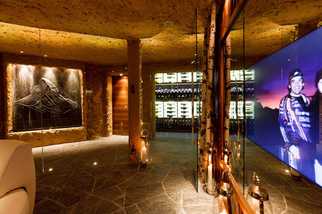 Ski room with TV and boot warmers at Chalet Zermatt Peak in Zermatt