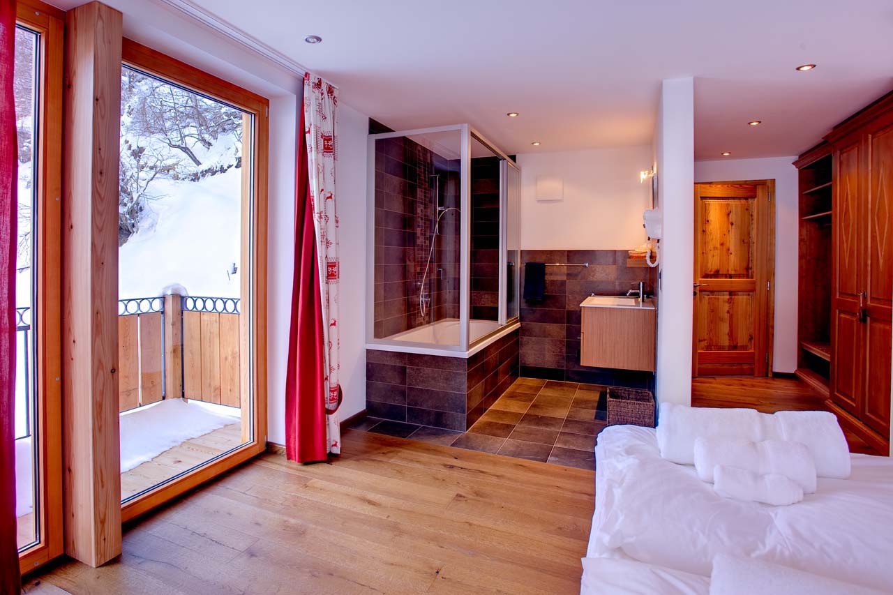 Chalet Gemini Zermatt double bedroom with open plan bathroom and separate WC