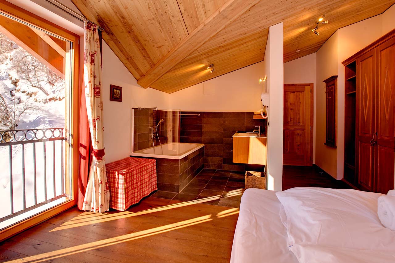 Chalet Gemini Zermatt double bedroom with open bathroom and views