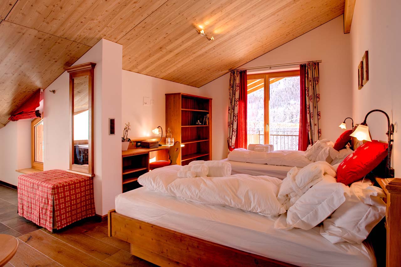 Chalet Gemini Zermatt double bedroom with open plan bathroom and Jacuzzi bath