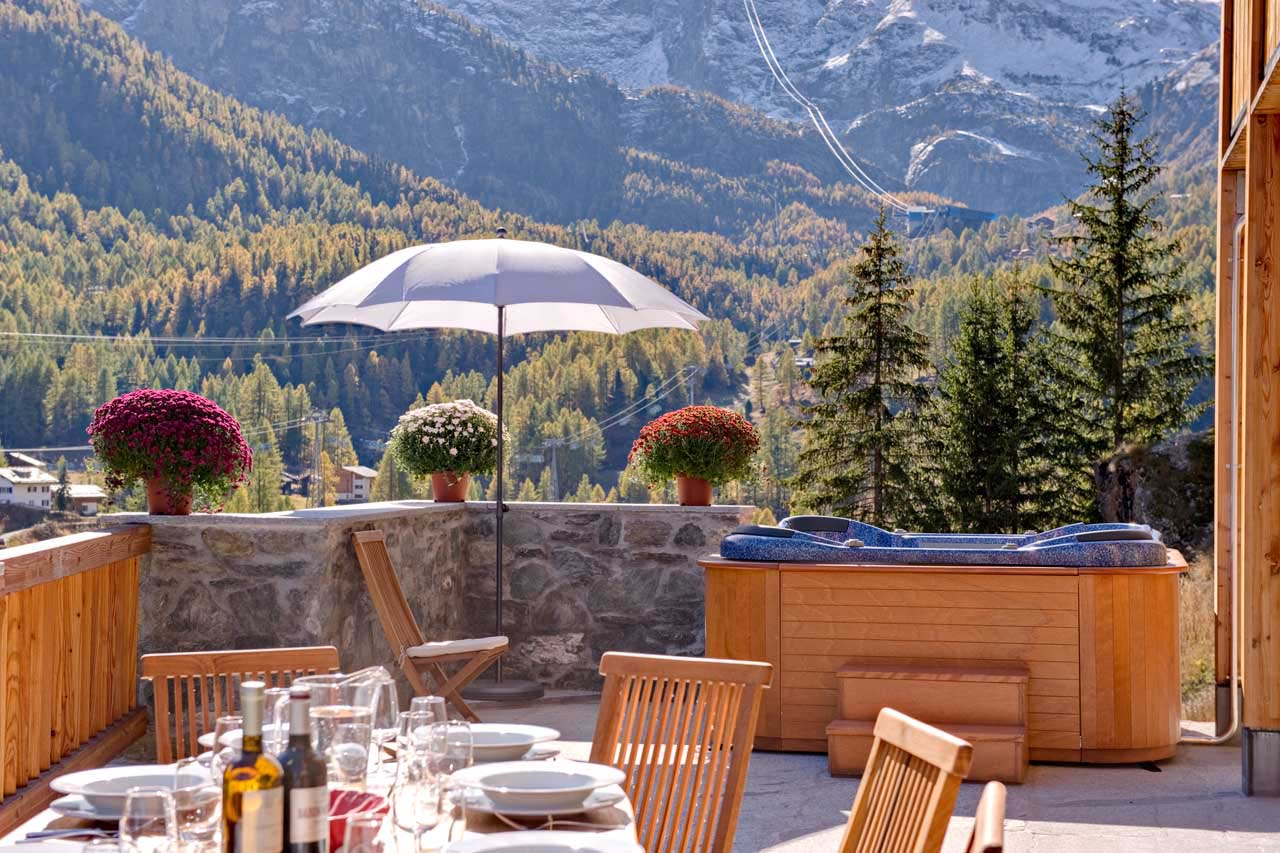 Chalet Gemini Zermatt terrace in summer with hot tub
