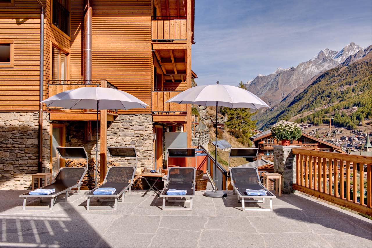 Chalet Gemini Zermatt deck chairs on the terrace in summer