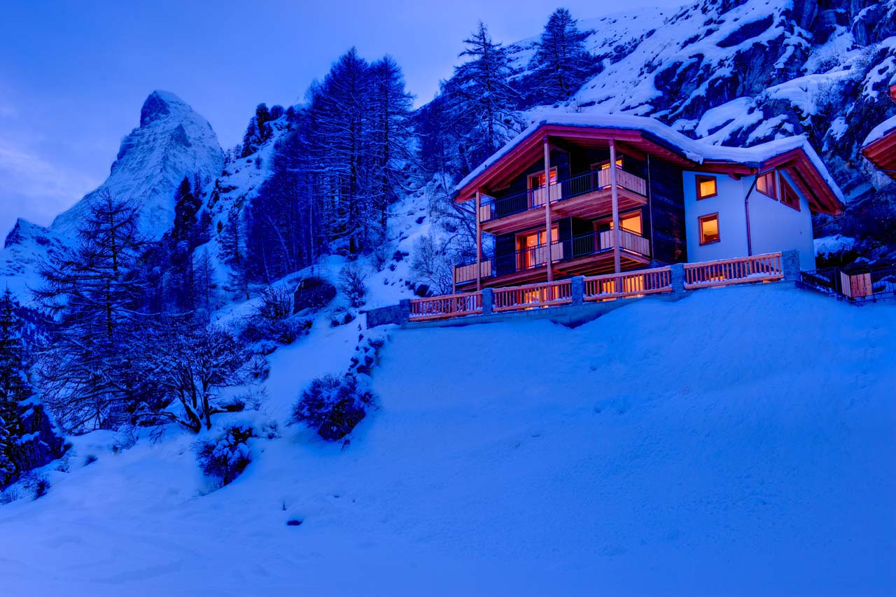 Chalet Gemini Zermatt exterior at night with view of Matterhorn